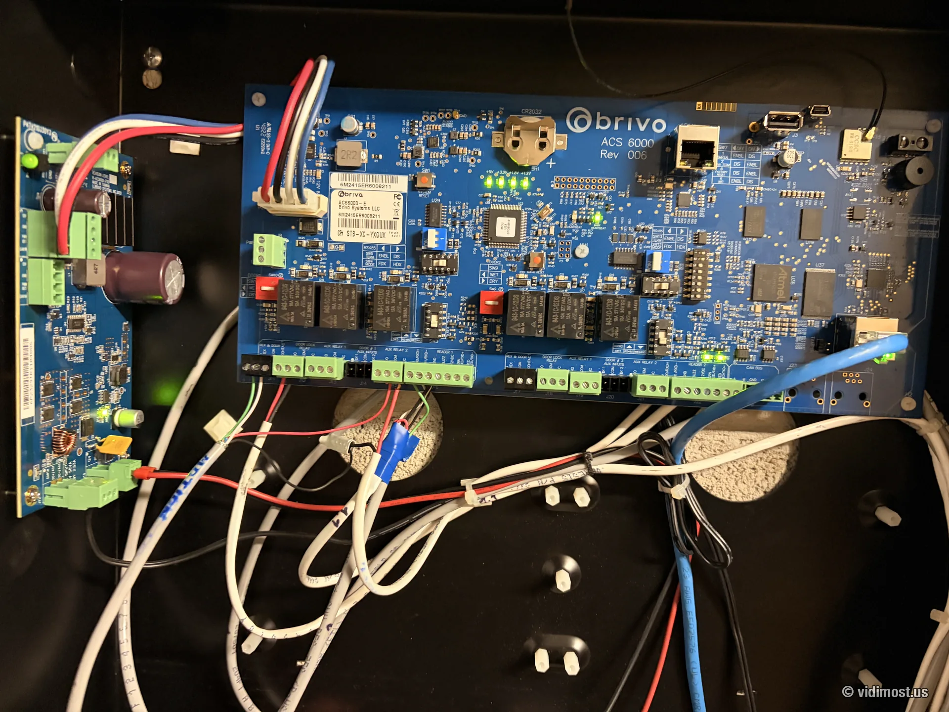 Open access control panel with a wired Brivo ACS6000 main board during commissioning
