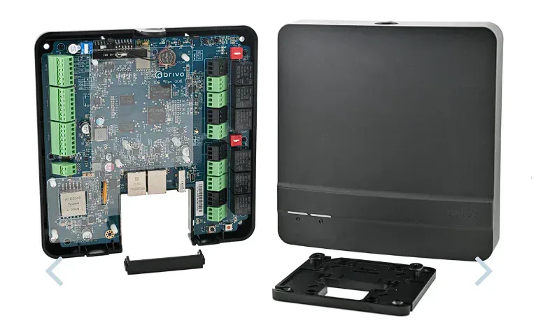 Brivo ACS300-E-B controller open enclosure showing the main board with terminal blocks for two doors, reader inputs, lock outputs, and network connections